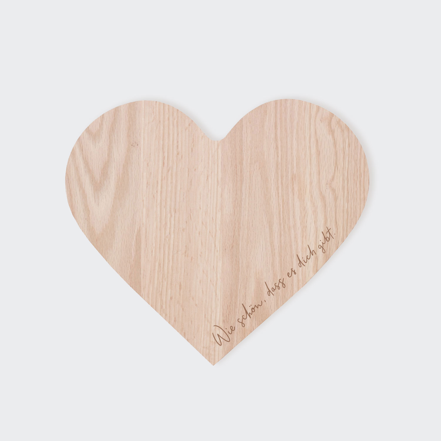 Holzbrett als Herzform mit der Aufschrift "Wie schön das es dich gibt"